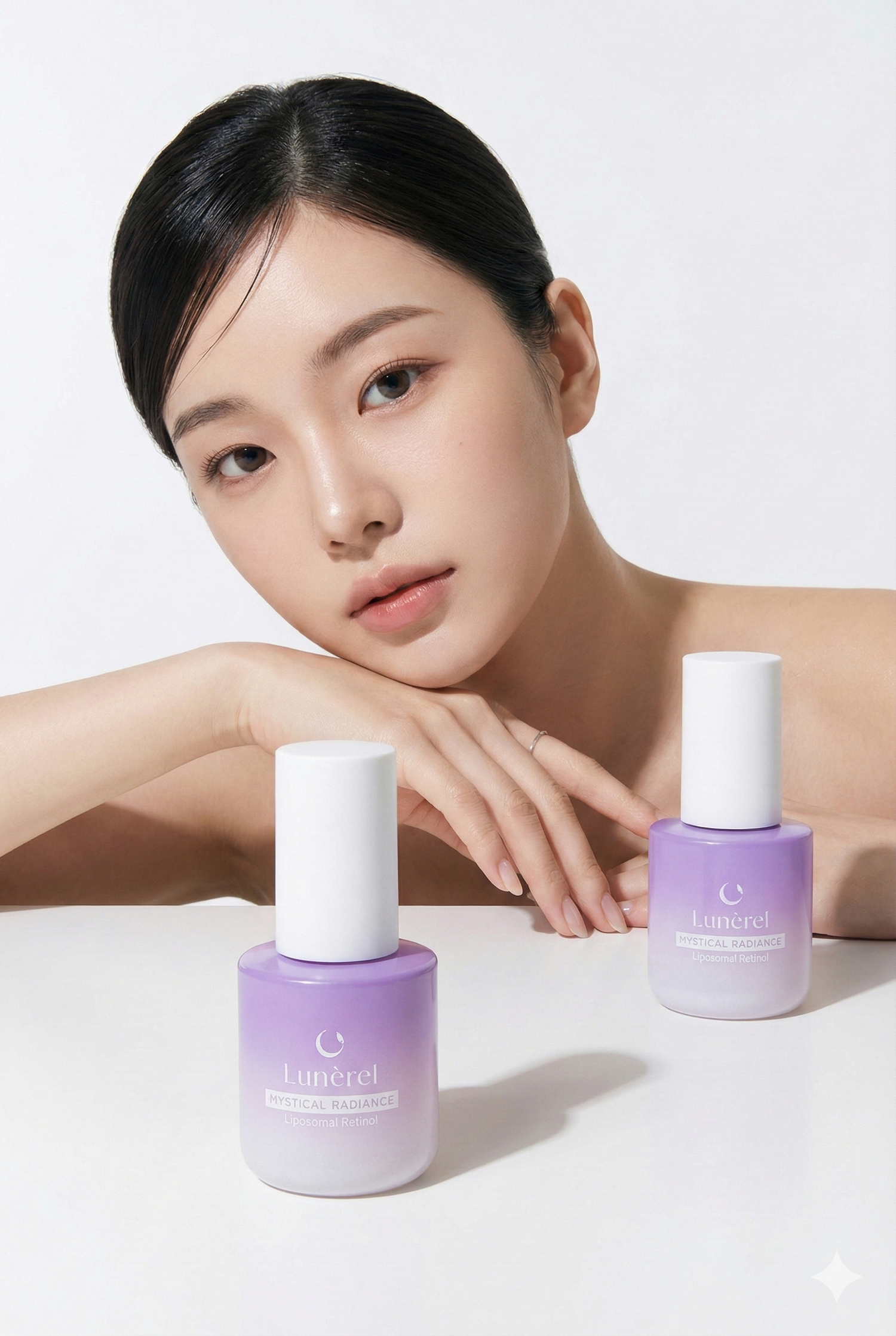 Model with Lunérel Mystical Radiance Serum bottles, liposomal retinol skincare